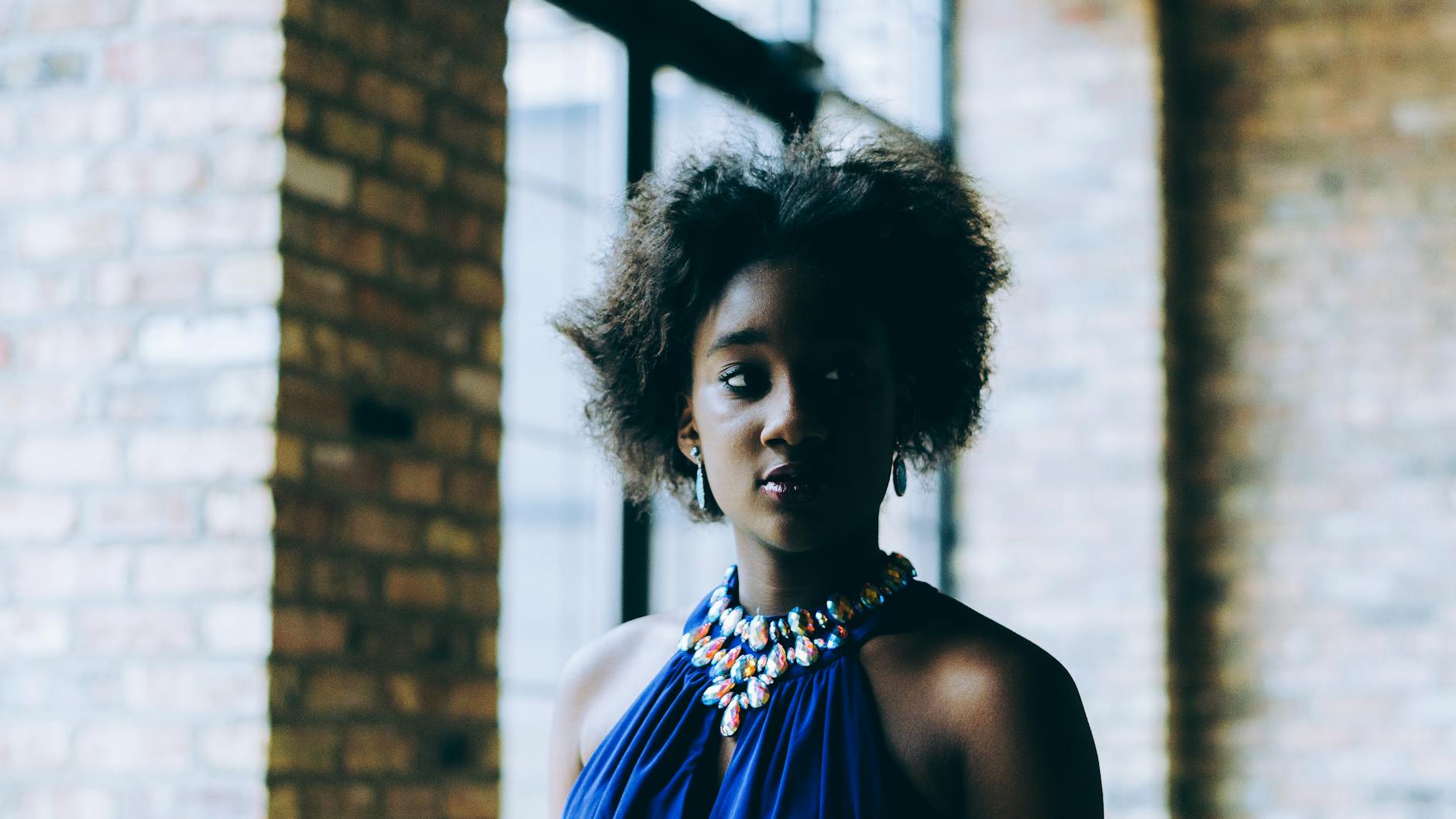 Photo Of Woman Wearing Blue Top