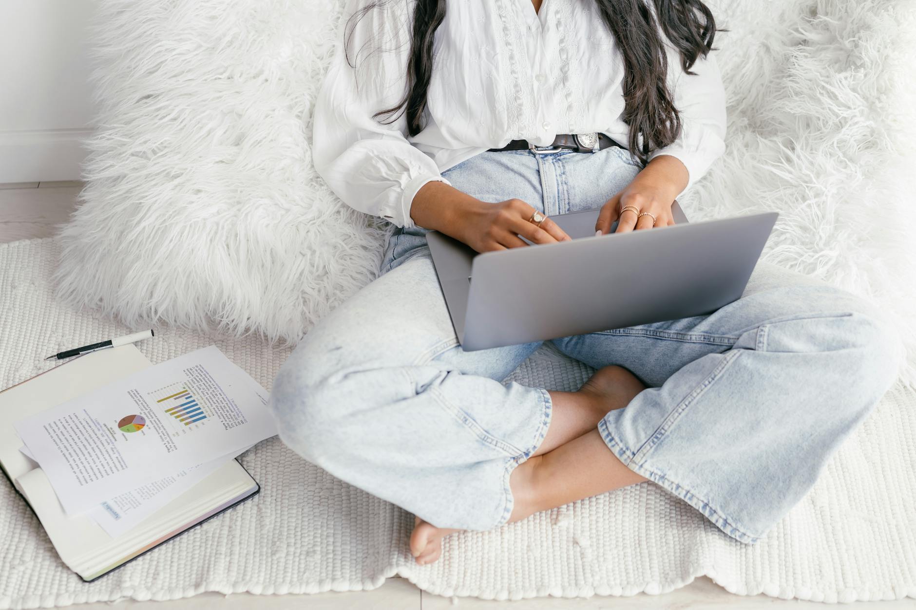 E-learning with a Laptop and a Book on a Floor