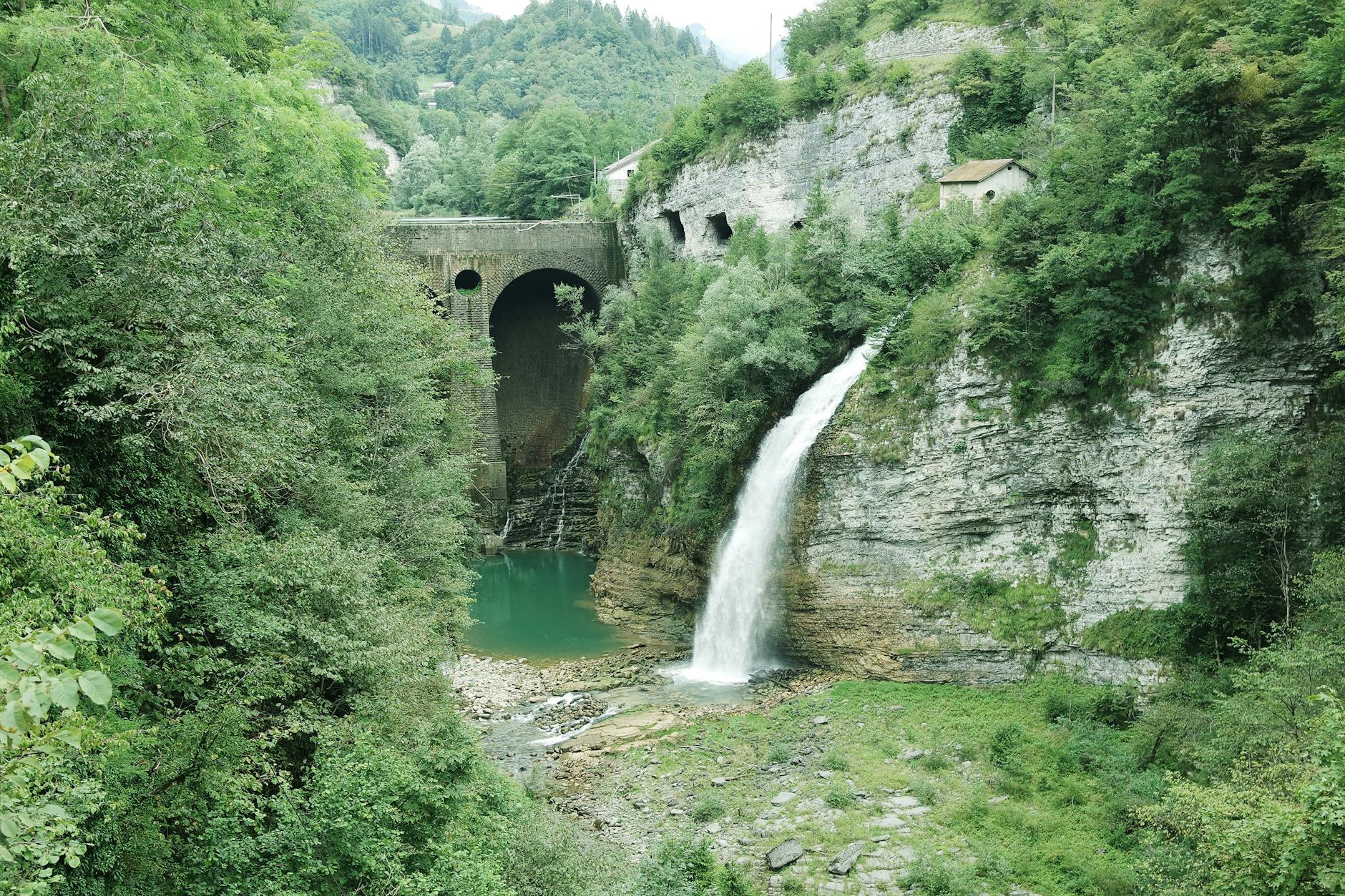 View of the Serra Bridge WaterfallTrasaZapisz near Lamon, Italy