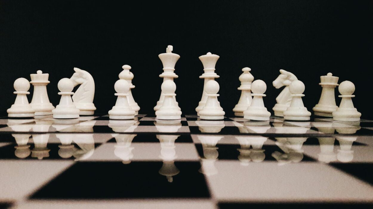 White Chess Piece on Top of Chess Board