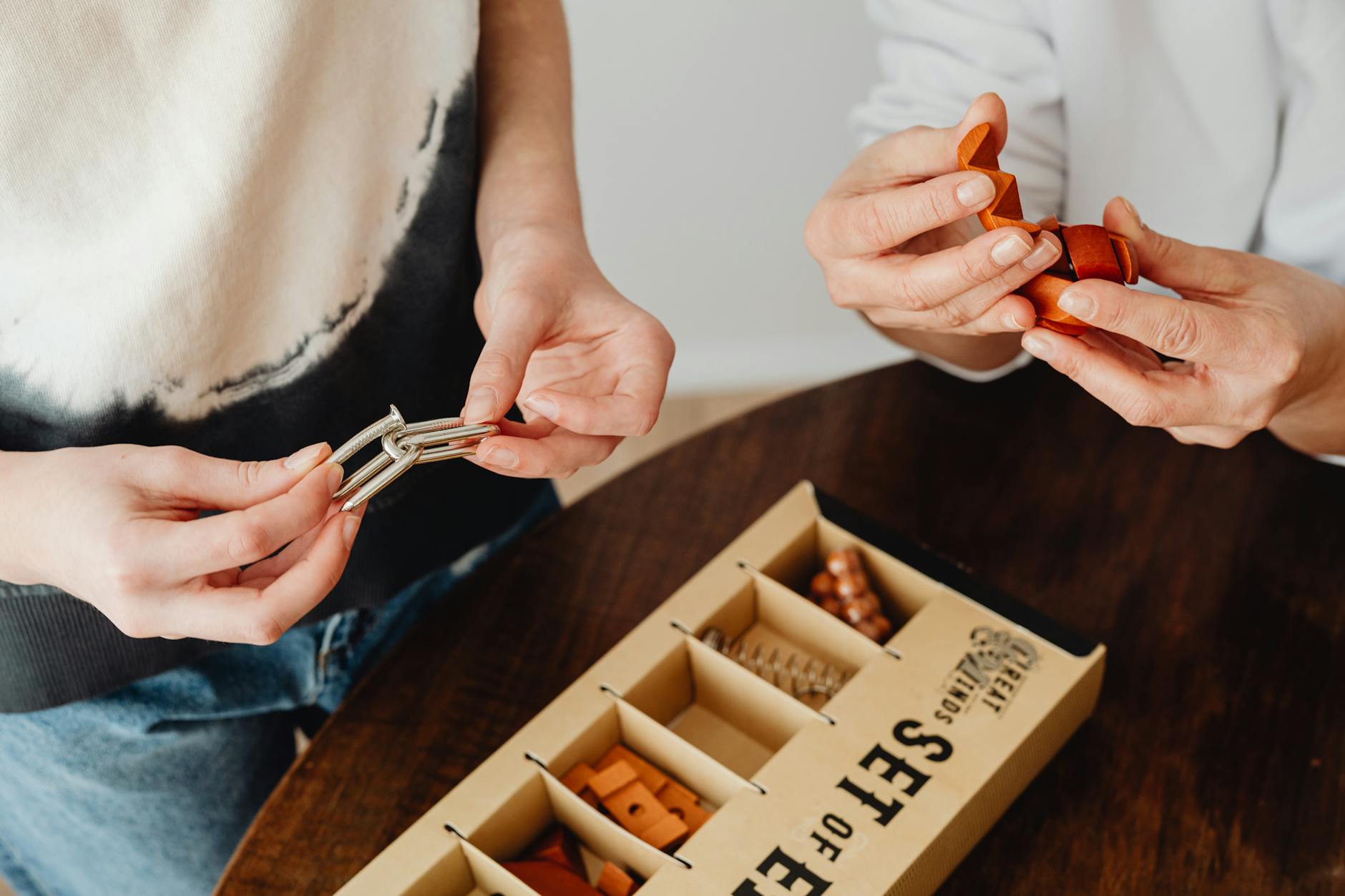 Two People Trying to Solve Different Puzzle Puzzle