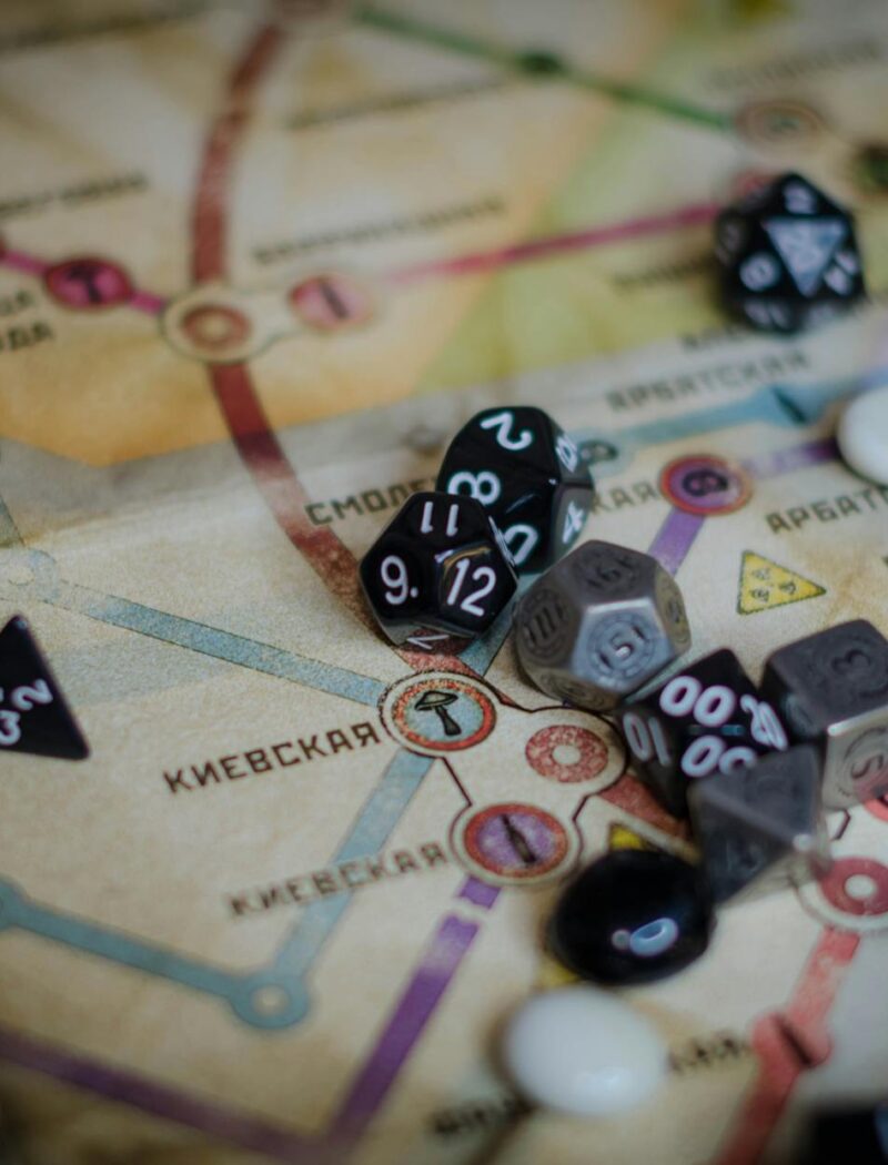 Gray and Black Dice on Board Game