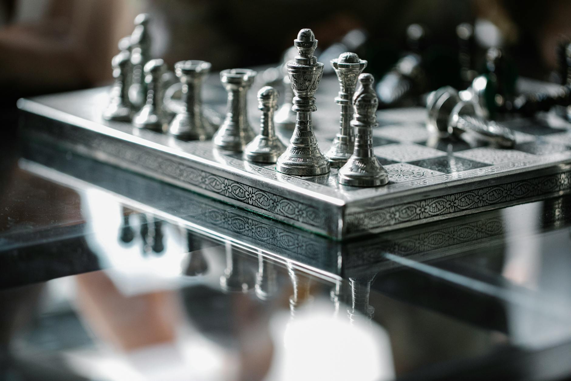 Metal carved chess board with set pieces