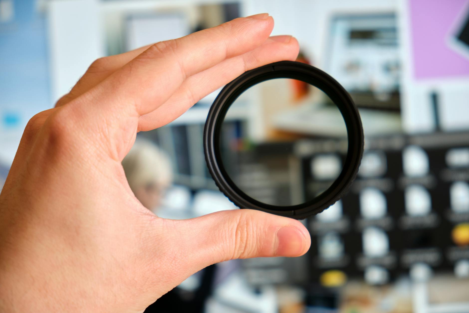 Person Holding Black Round Frame